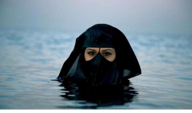 From YourMiddleEast: Image from Saudi Arabia Photographer Sebastian Farmborough went to Saudi Arabia and saw this woman out at sea. © Sebastian Farmborough